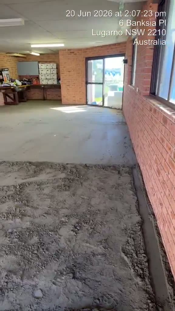 Sand and cement screed being laid